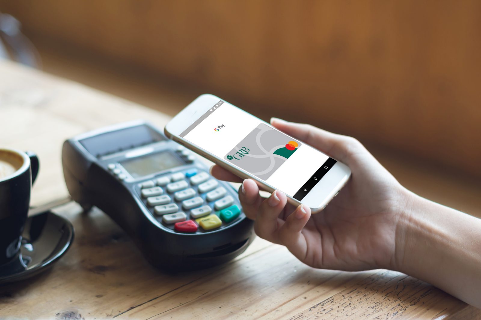 Mobile phone with Digital Wallet debit card on screen