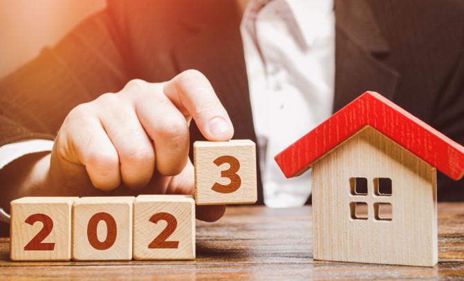 Wooden blocks with a house and 2023 spelled out