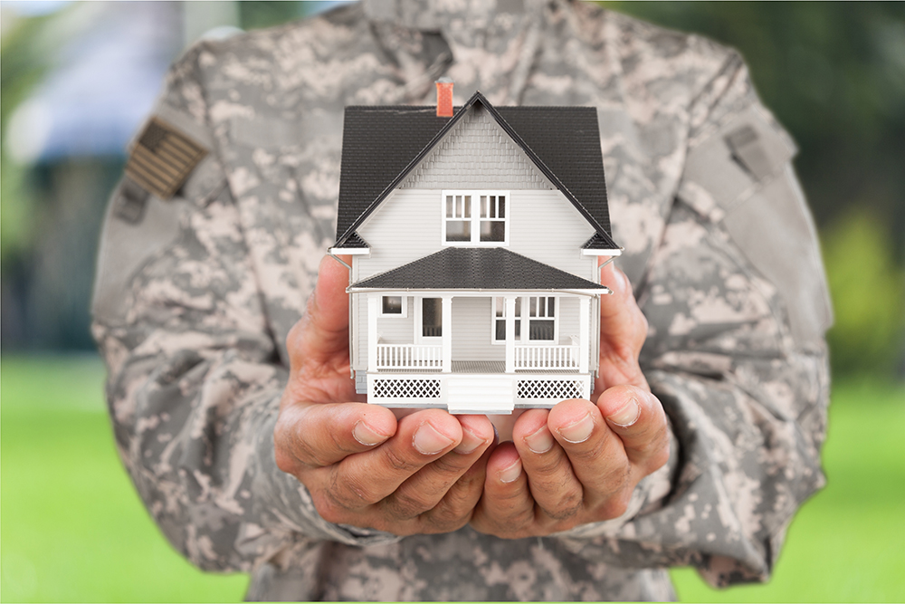 IRRRL military man holding house