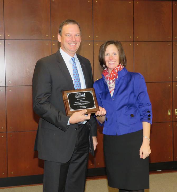 Dave Halladay accepts SBA Silver Award for GRB's small business lending practices.