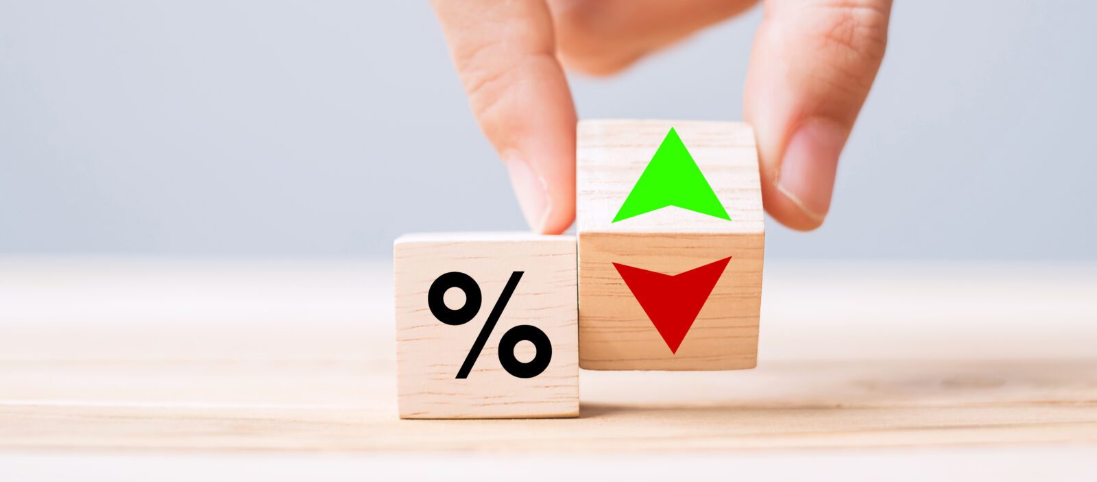 Blocks with interest rates and arrows going up and down.