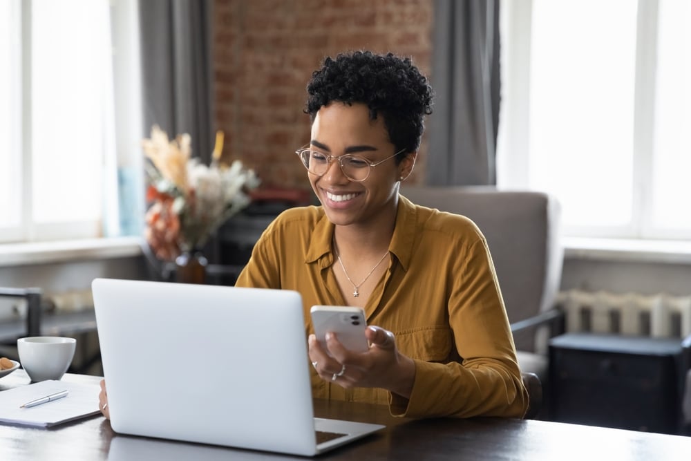 Healthcare professional woman behind a desk doing her practice's online and mobile banking