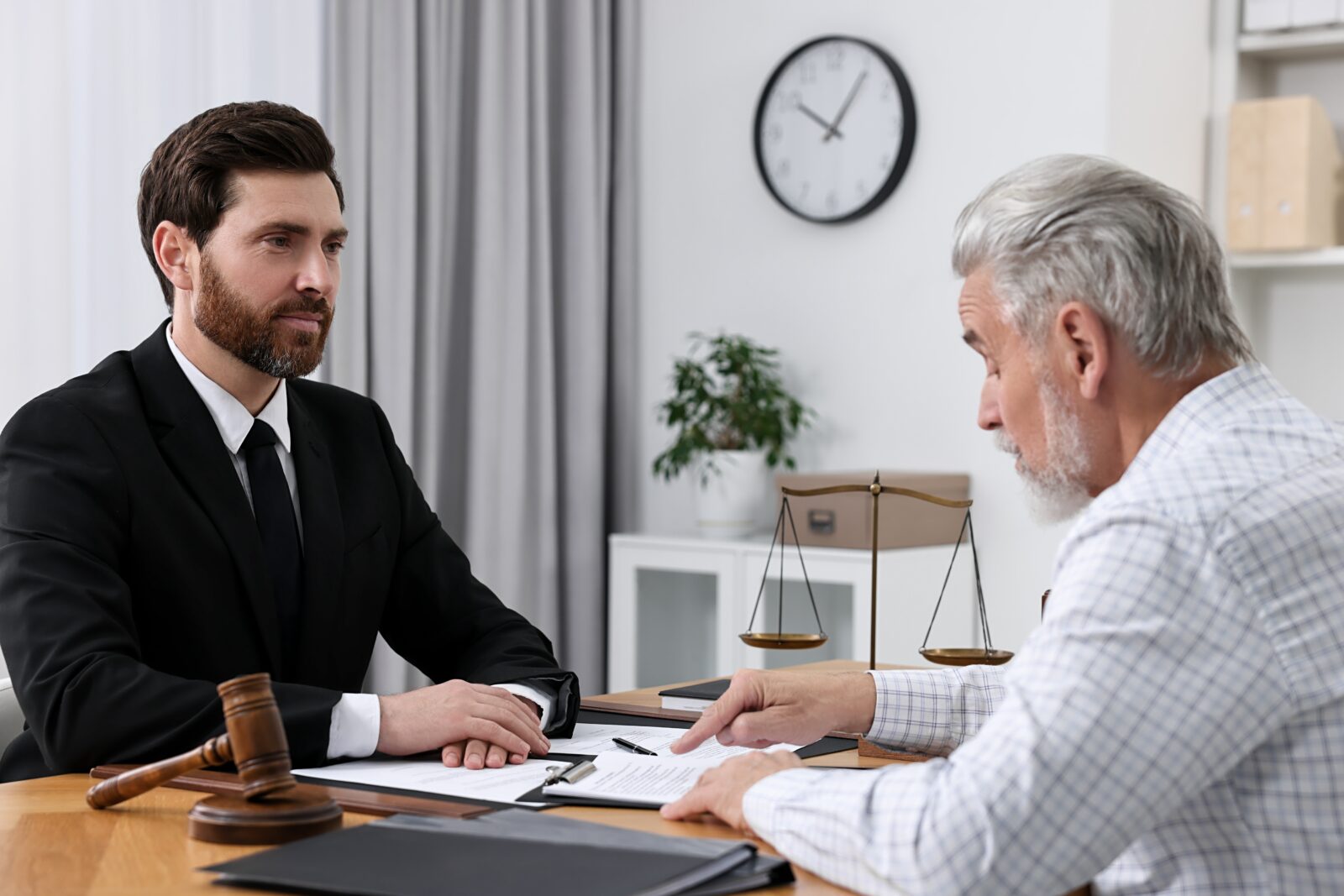 Man meeting with an attorney to discuss next steps in the estate settlement process.
