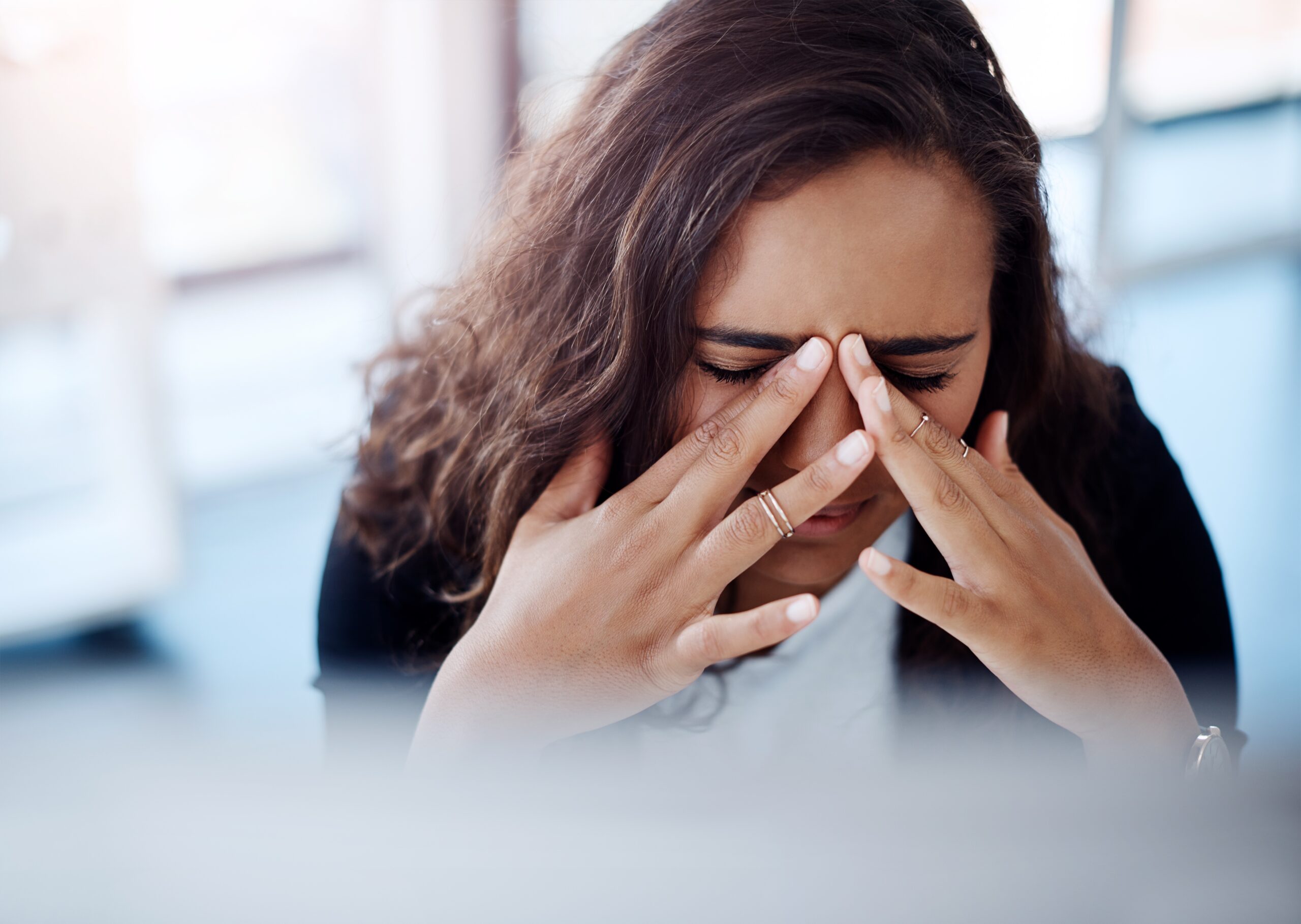 Woman facing stress and anxiety of an estate settlement with mistakes.