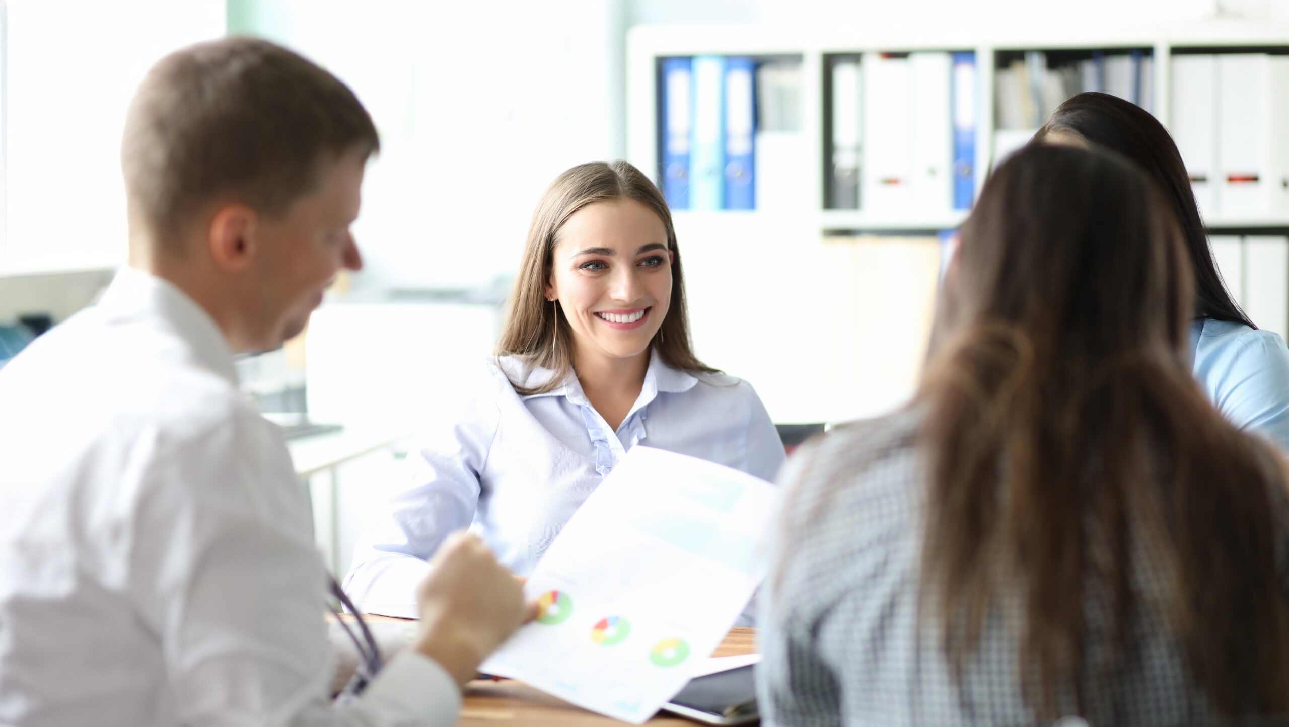 Group of employees meeting with a financial literacy specialist.