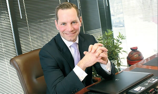 Genesee Regional Bank President Phil Pecora sitting at his desk